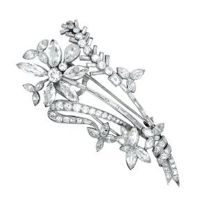 An Art Déco platinum and diamond brooch in the shape of a flower branch. Kutchinsky, London 1830 circa